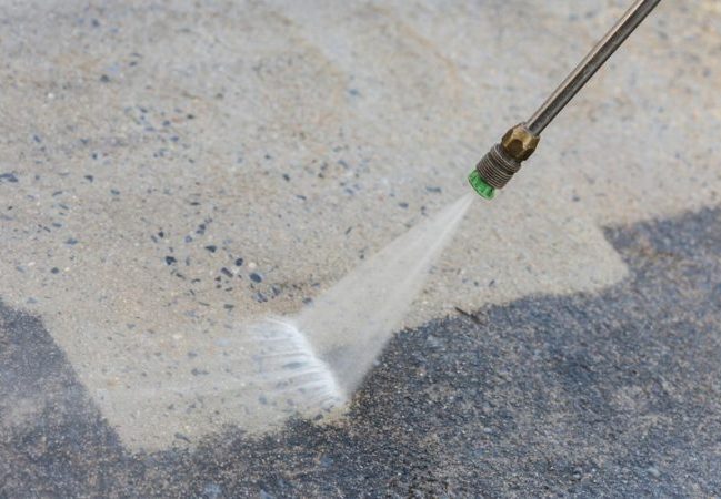 homeguide-pressure-washing-driveway-removing-mildew-and-dirt